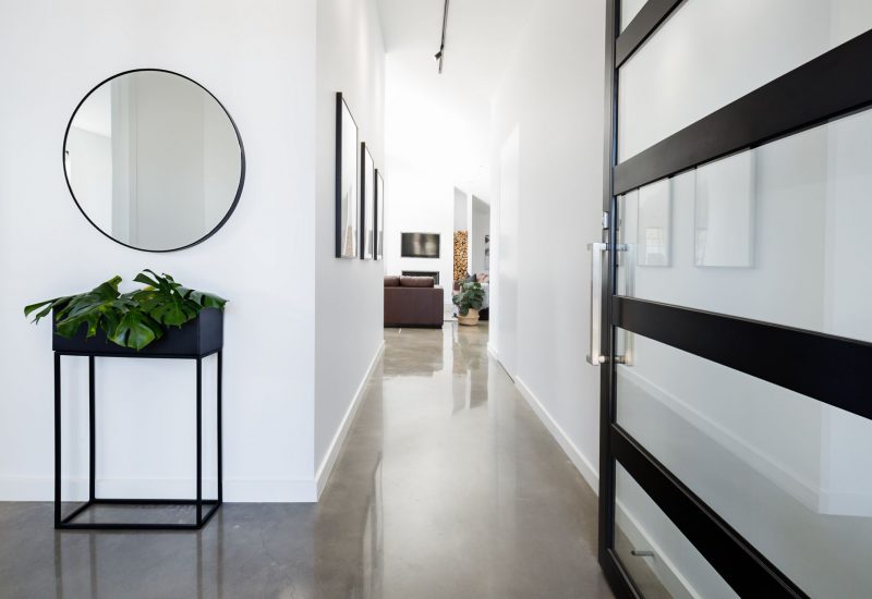 Contemporary home entry hall with polished concrete floors
